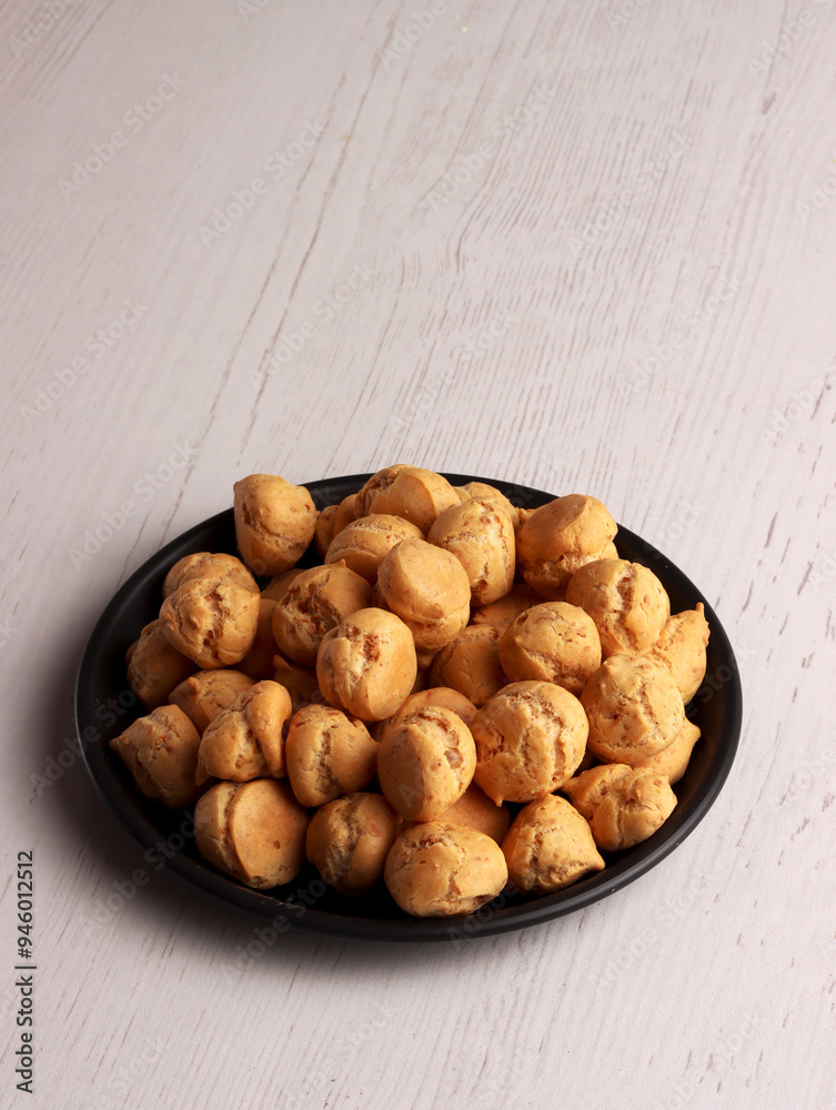 Fototapeta premium sus kering snack choux pastry indonesian traditional puff homemade dessert eclairs cookie sugar fat
