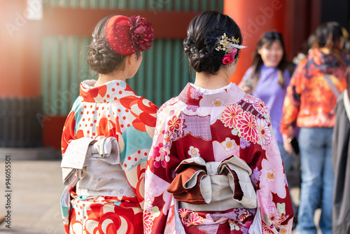Young girl wearing Japanese kimono standing in front of Sensoji Temple in Tokyo, Japan. Kimono is a Japanese traditional garment. The word 