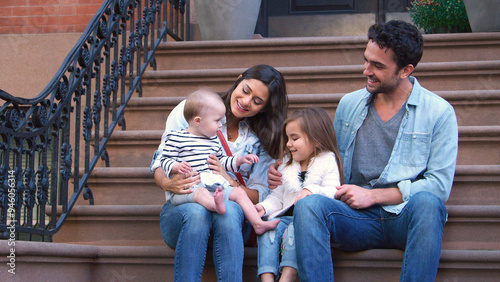 Photography Family With Young Children Sitting Steps Outside Home On Urban Street In New Yor