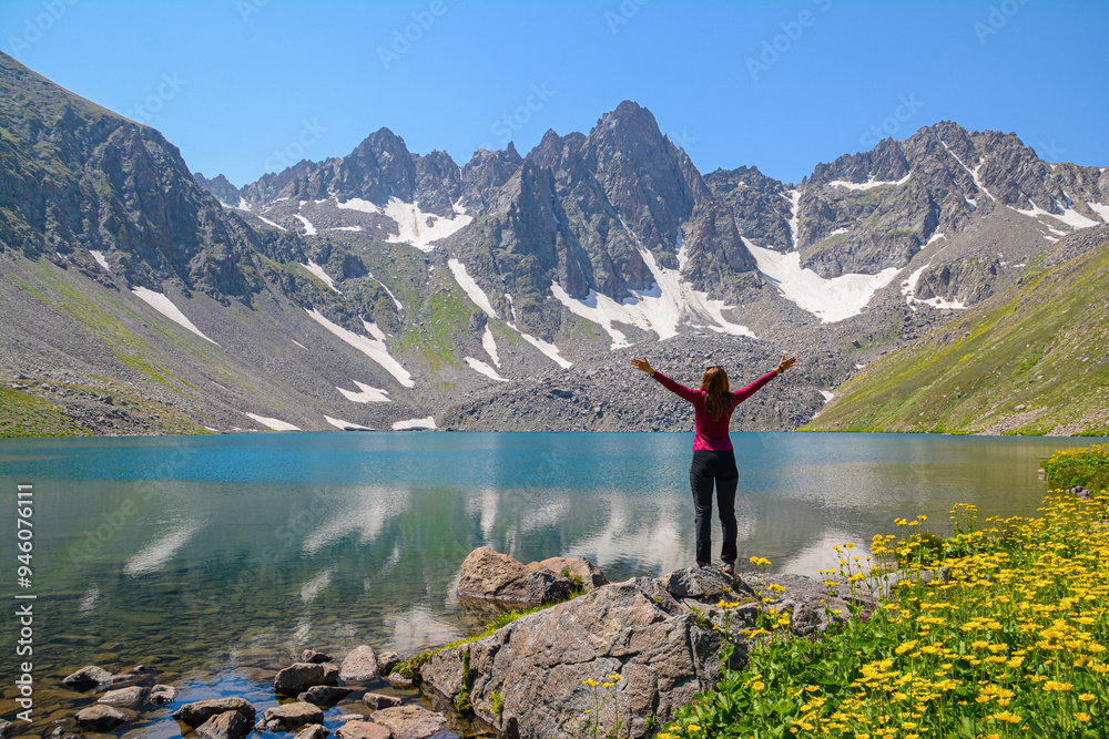 Travelers in nature. Hiking in the mountains. Documentary photo with tourists. Beautiful mountains, crystal clear lake and travel. Lake and mountains. Wall art Travelers in nature. Hiking in the mountains. Documentary photo with tourists. Beautiful mountains, crystal clear lake and travel. Lake and mountains. Wall art