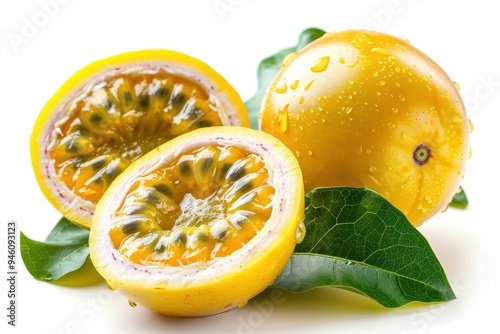 Half cut yellow passion fruit with leaf on white background