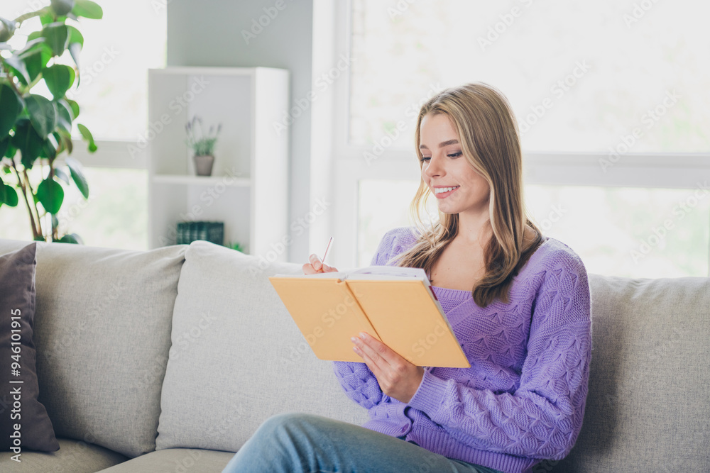 Photo of lovely cheerful girl sit couch write notebook dressed violet garment spend pastime spacious house indoors room Photo of lovely cheerful girl sit couch write notebook dressed violet garment spend pastime spacious house indoors room