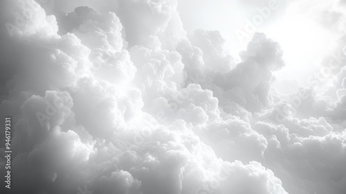 Sunlight shining through dramatic white clouds in sky