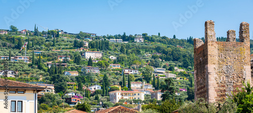 Holiday homes on a mountainside near the village of Torri del Benaco on Lake Garda, Italy photo