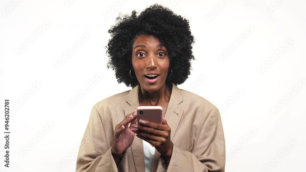Excited woman using smartphone isolated on white background Excited woman using smartphone isolated on white background