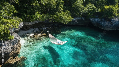 A hammock on a secluded island with crystal-clear water and lush greenery, ideal for an exclusive tropical escape