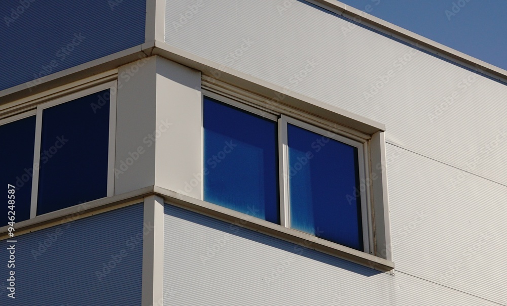 windows in the facade of an industrial building windows in the facade of an industrial building