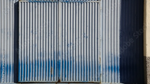 large industrial metal blue door warehouse entrance