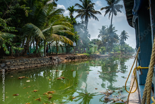 A beautiful, tropical scene cruising down the backwaters of Kerala in India