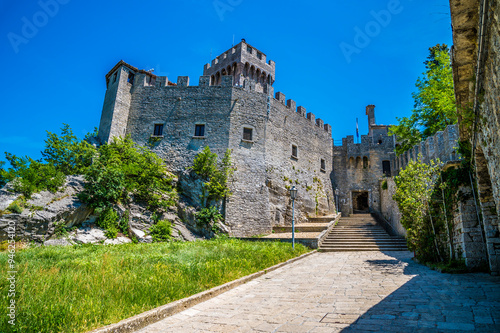 A view towards steps leading to the entrance to the second tower in the fortified section of San Marino, Italy in summertime photo