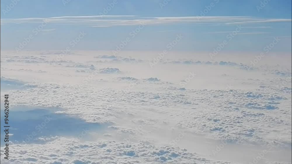 Natural abstract clouds background with white texture with Cumulus over mountains and blue hirizon of sky - aerial view over cloudy land. Topics: weather, meteorology, space, atmosphere, air travel Natural abstract clouds background with white texture with Cumulus over mountains and blue hirizon of sky - aerial view over cloudy land. Topics: weather, meteorology, space, atmosphere, air travel