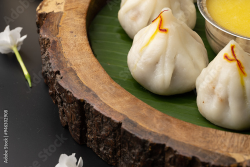 Steamed or ukdiche Modak. It's a traditional sweet dish made out of coconut, jaggery and dry fruits stuffed inside rice dough. Offered to Lord Ganesha