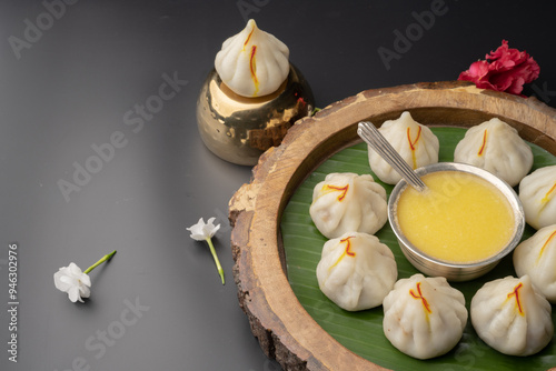 Steamed or ukdiche Modak. It's a traditional sweet dish made out of coconut, jaggery and dry fruits stuffed inside rice dough. Offered to Lord Ganesha photo