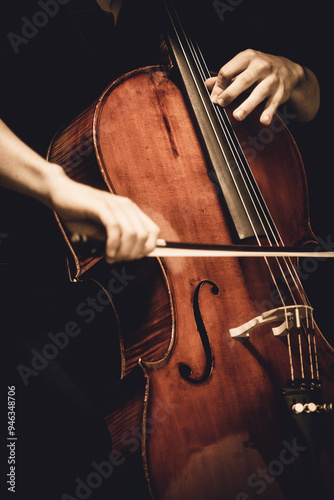 guy playing cello close up
