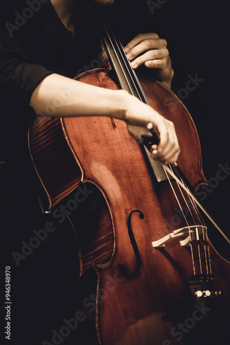 guy playing cello close up photo