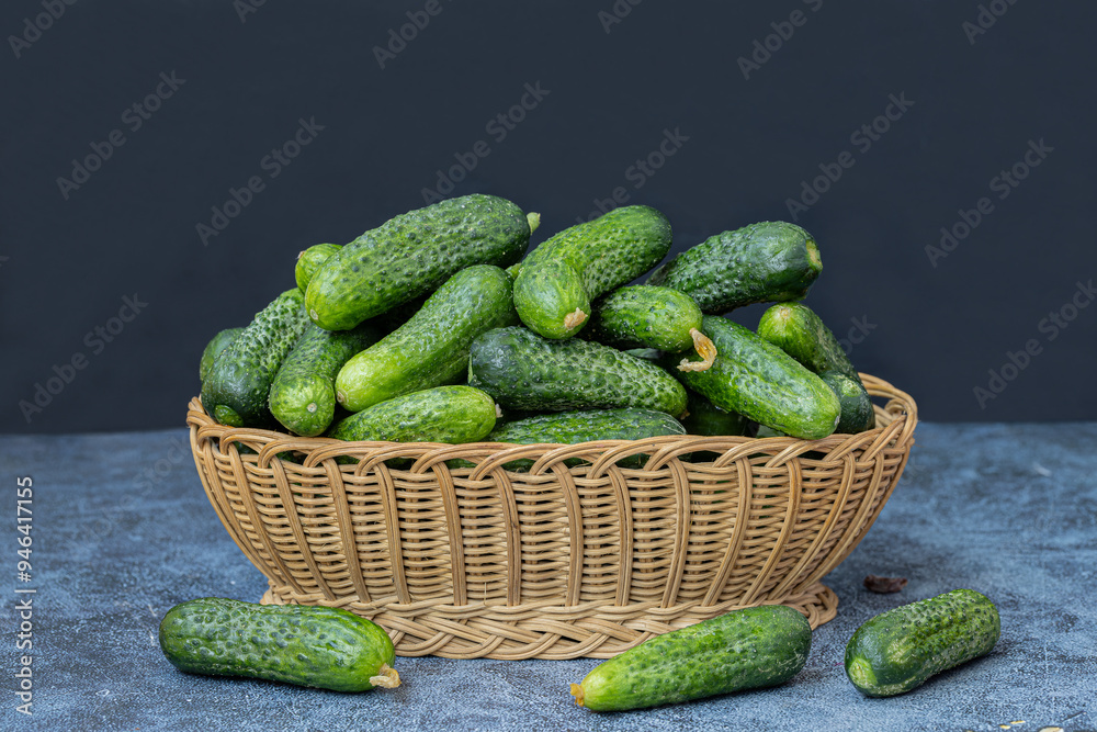 Fresh Cornichon cucumbers in a basket.