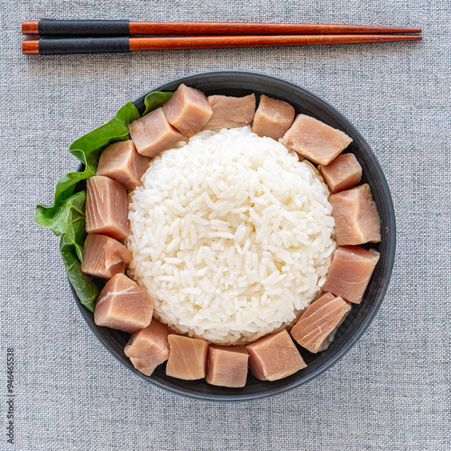 Bowl of tuna, rice, mangold. Top view. Asian food.
