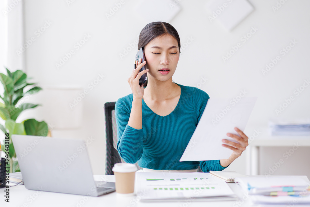 Cheerful business Asian woman freelancer making telephone call share good news about project working in office workplace, business finance concept.
Cheerful business Asian woman freelancer making telephone call share good news about project working in office workplace, business finance concept.