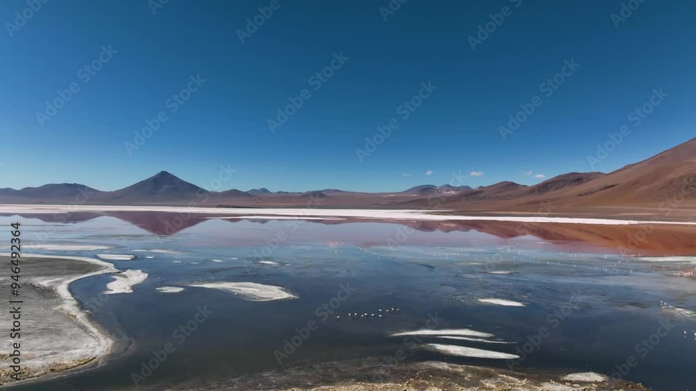 Aerial view of the beautiful Laguna Colorada with flamingos in a serene desert landscape, Bolivia. Aerial view of the beautiful Laguna Colorada with flamingos in a serene desert landscape, Bolivia.
