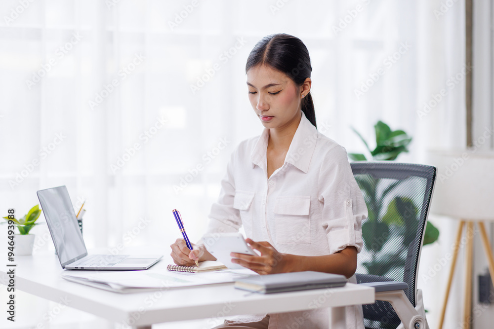 Asian Business woman using calculator and laptop for doing math finance on an office desk, tax, report, accounting, statistics, and analytical research concept
Asian Business woman using calculator and laptop for doing math finance on an office desk, tax, report, accounting, statistics, and analytical research concept