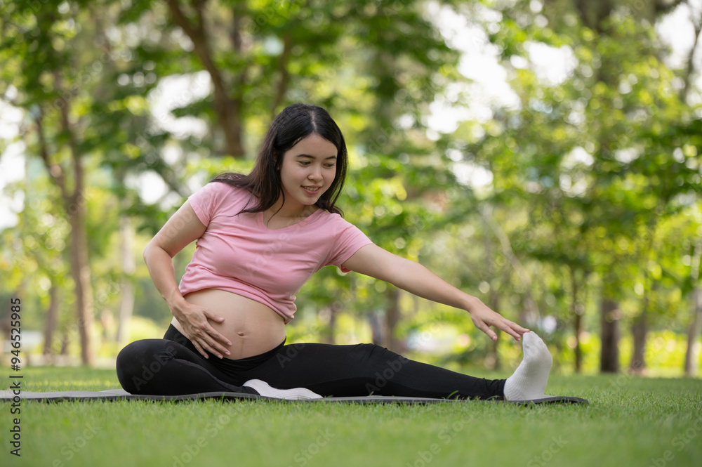 Asian pregnant woman relaxing and stretching in the garden Asian pregnant woman relaxing and stretching in the garden
