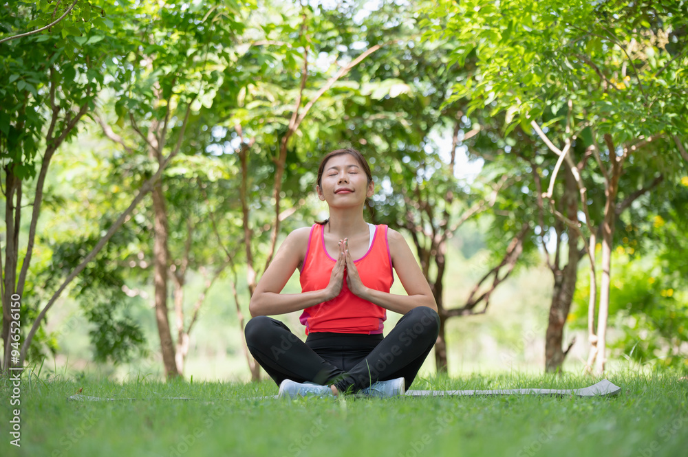 Asian woman doing yoga exercise and relax with sportswear in park, sport and healthy lifestyle concept Asian woman doing yoga exercise and relax with sportswear in park, sport and healthy lifestyle concept