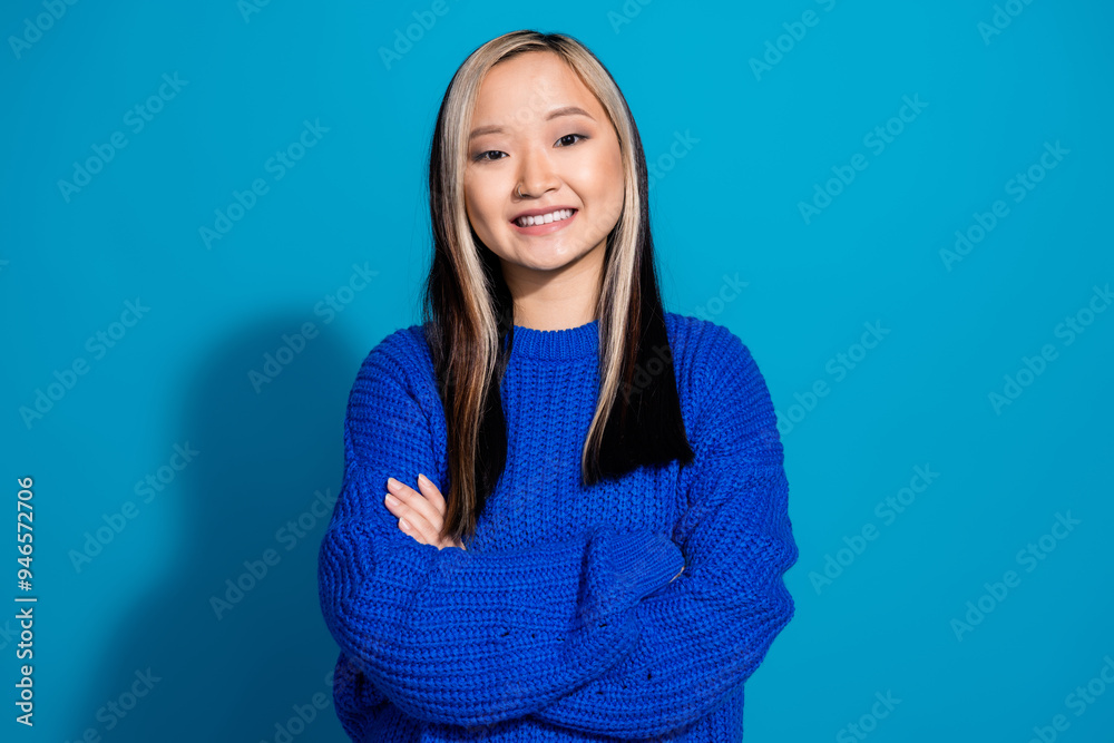 Fototapeta premium Portrait photo of dyed hair young vietnamese girl folded hands satisfied smiling seems confident isolated on blue color background