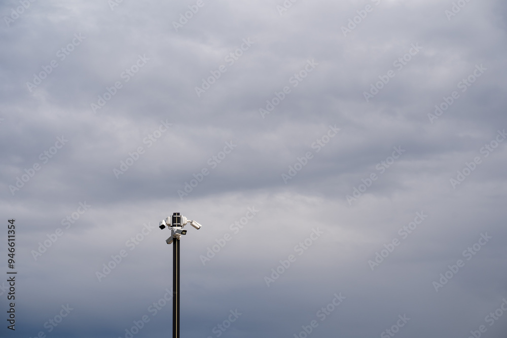 A strong and durable metal pole equipped with a highdefinition camera diligently captures the breathtaking beauty of the sky along with the picturesque landscape that surrounds it A strong and durable metal pole equipped with a highdefinition camera diligently captures the breathtaking beauty of the sky along with the picturesque landscape that surrounds it
