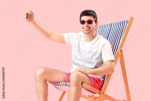 Young man with mobile phone...