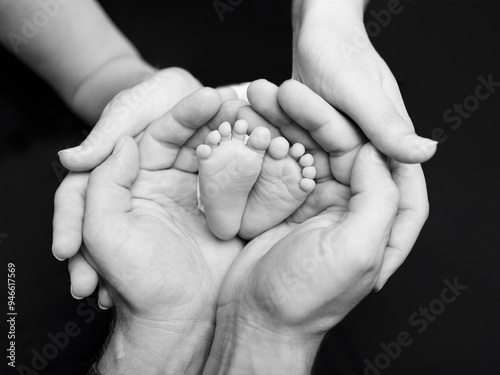 Parents holding baby feet