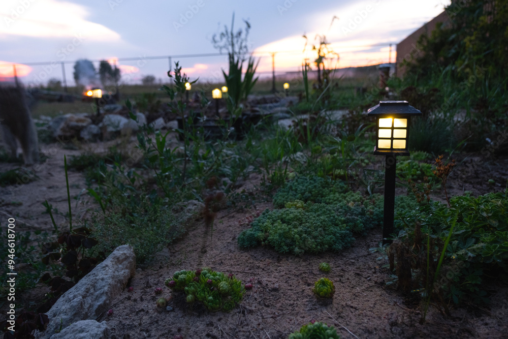Solar-powered lanterns for flower beds in the yard of the house for decorative street lighting and landscaping Solar-powered lanterns for flower beds in the yard of the house for decorative street lighting and landscaping