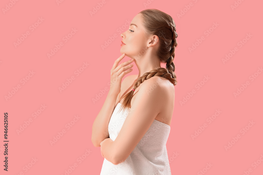 Pretty young woman wrapped in towel on pink background Pretty young woman wrapped in towel on pink background