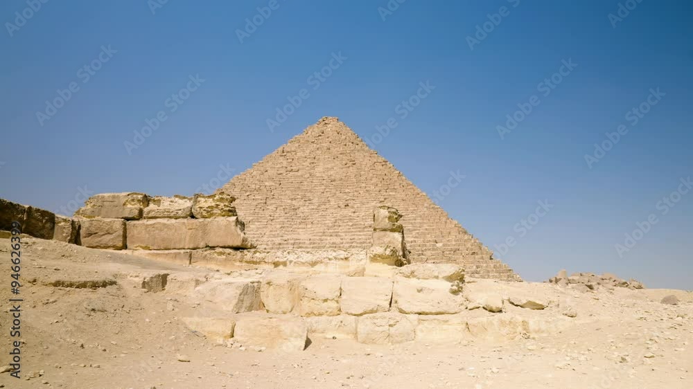 Pyramid Complex Of Limestone Plateau In Giza, Egypt, Middle East. Tilt-up Shot Pyramid Complex Of Limestone Plateau In Giza, Egypt, Middle East. Tilt-up Shot