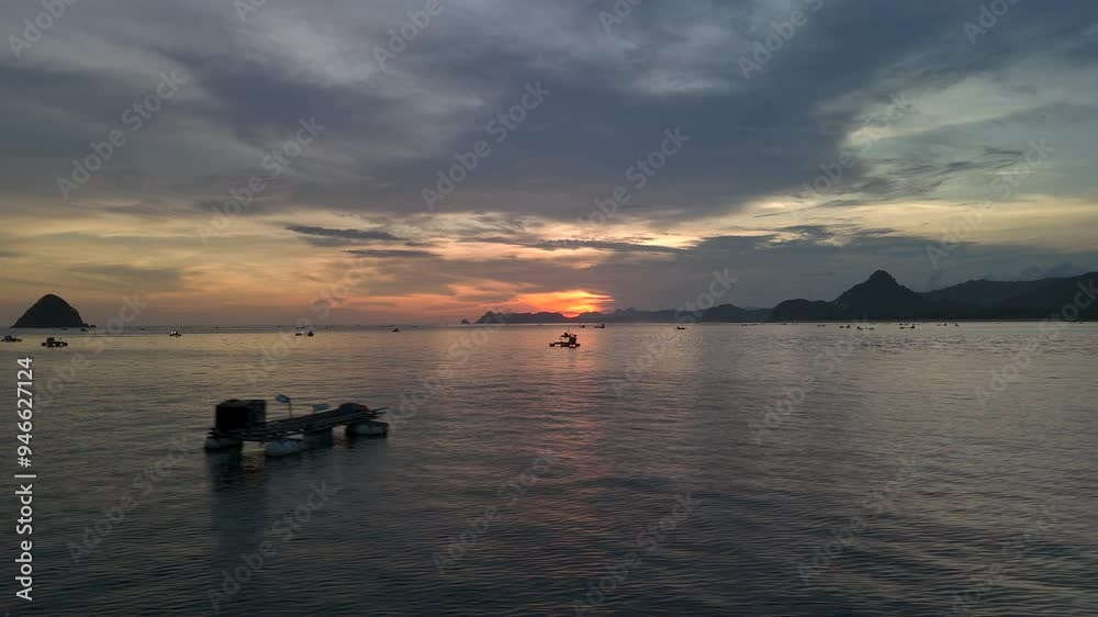 Drone flight over ocean with Outrigger boats on sea Kenawa Island, Indonesia Drone flight over ocean with Outrigger boats on sea Kenawa Island, Indonesia