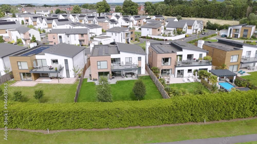 Aerial view of newly built luxury homes on a residential estate, showcasing modern architecture and high-end living in the UK Aerial view of newly built luxury homes on a residential estate, showcasing modern architecture and high-end living in the UK