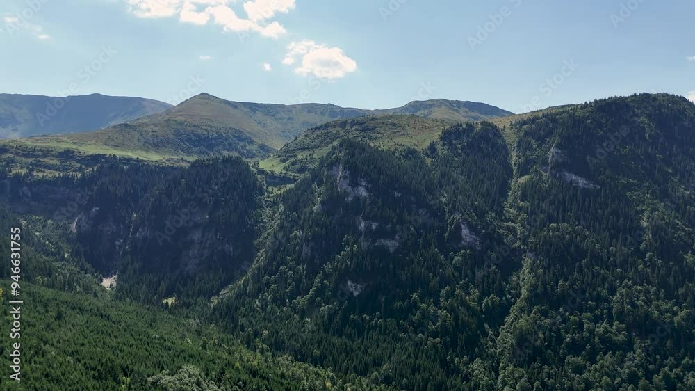 Slow aerial reveal of Rodnei National Park in Borsa, located in the Bucovina region of Romania Slow aerial reveal of Rodnei National Park in Borsa, located in the Bucovina region of Romania
