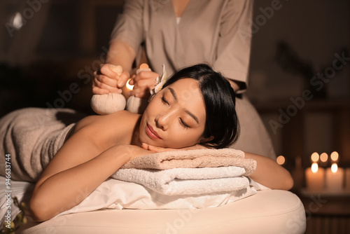 Pretty young Asian woman ha...