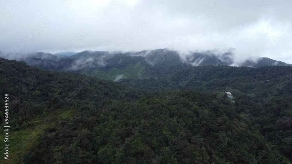 Ominous ambient shot of drone flying over a valley in the tropical highlands of Malaysia. Ominous ambient shot of drone flying over a valley in the tropical highlands of Malaysia.
