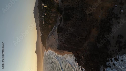 Vertical format aerial flight over Pt Dume cliffs to Malibu Beach, CA photo