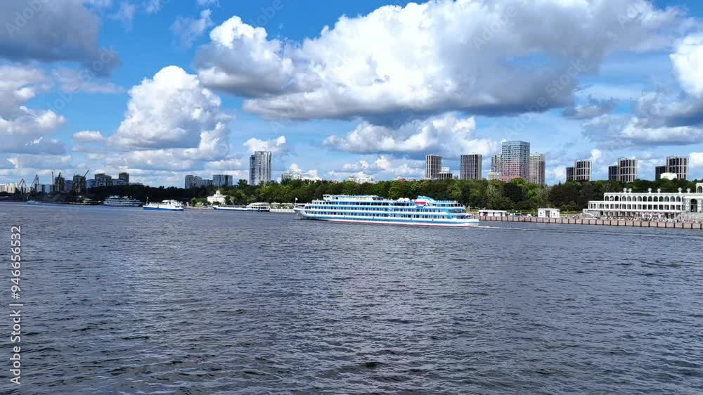 Severny Rechnoy Vokzal in Moscow after restoration, cruise river ships on the Moskva River arrive at Severny Rechnoy Vokzal, view of the Moscow canal, sunny day. Severny Rechnoy Vokzal in Moscow after restoration, cruise river ships on the Moskva River arrive at Severny Rechnoy Vokzal, view of the Moscow canal, sunny day.