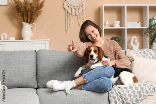 Young woman with cute Beagl...