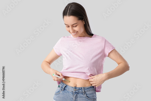 Diabetic young woman using ...