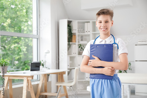Teenage doctor with clipboa...