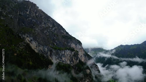 An aerial view of Camping Marmolada Malga Ciapela with the majestic Marmolada peak in the background, captured by a drone. Nestled in the heart of the Dolomites photo