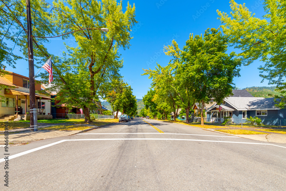 A wide tree lined street of homes in a residential neighborhood of the historic mining town of Kellogg, Idaho, in the Silver Valley district near Coeur d'Alene. A wide tree lined street of homes in a residential neighborhood of the historic mining town of Kellogg, Idaho, in the Silver Valley district near Coeur d'Alene.