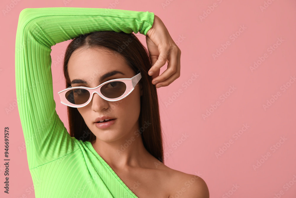 Beautiful young woman in stylish sunglasses on pink background Beautiful young woman in stylish sunglasses on pink background