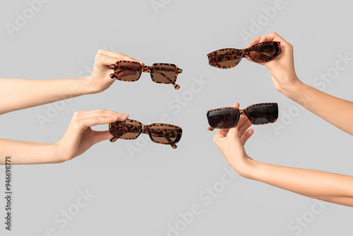 Multiple hands holding leop...