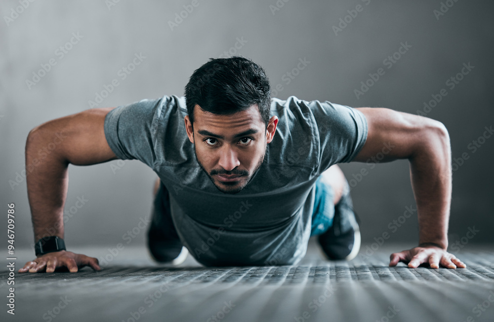 Fototapeta premium Asian man, portrait and push up in gym for fitness, strong muscle development and intensity workout. Male person, core and confident in exercise routine at club, training challenge and bodybuilder
