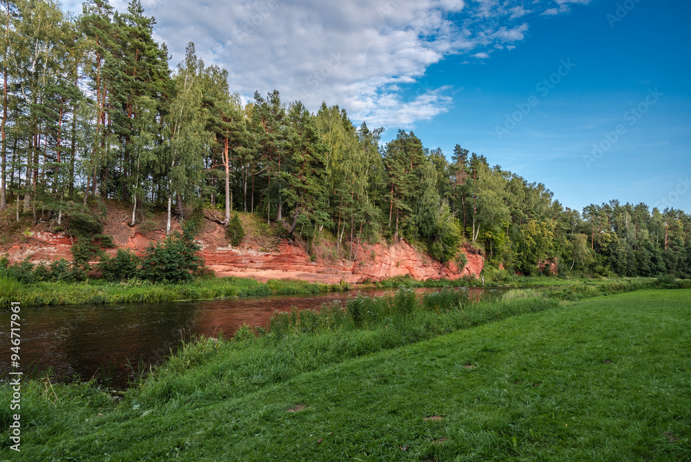 Red cliffs (latvian: Sarkanās klintis) on Salaca river in Latvia at summer Red cliffs (latvian: Sarkanās klintis) on Salaca river in Latvia at summer