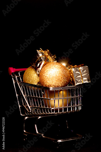 supermarket cart full of golden balls and christmas gifts